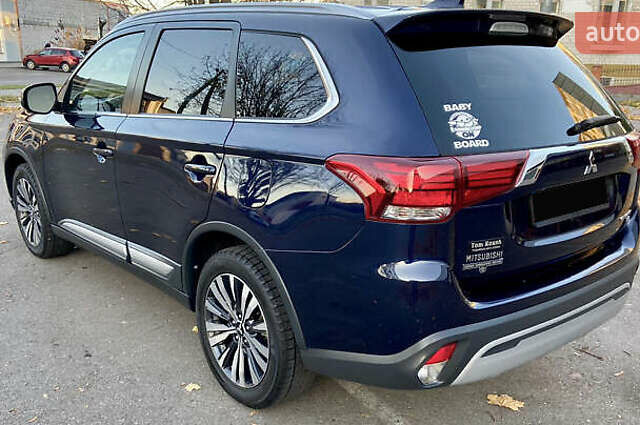 Синий Мицубиси Аутлендер, объемом двигателя 2.36 л и пробегом 71 тыс. км за 13800 $, фото 4 на Automoto.ua