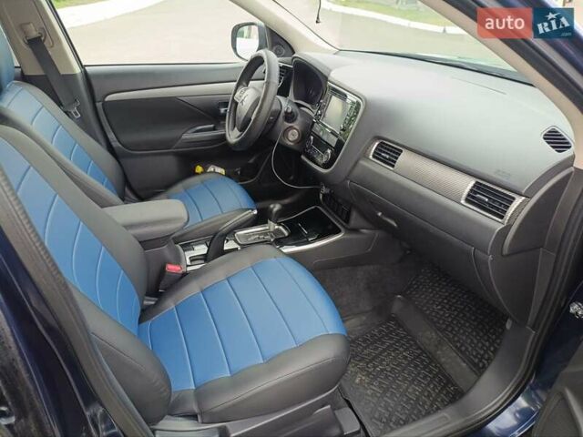 Синий Мицубиси Аутлендер, объемом двигателя 2.4 л и пробегом 134 тыс. км за 15200 $, фото 5 на Automoto.ua