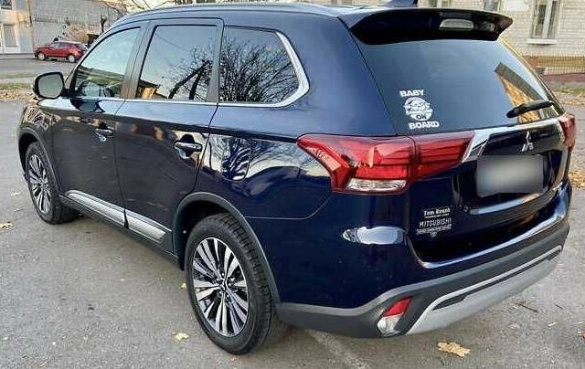 Синий Мицубиси Аутлендер, объемом двигателя 2.4 л и пробегом 71 тыс. км за 11800 $, фото 4 на Automoto.ua