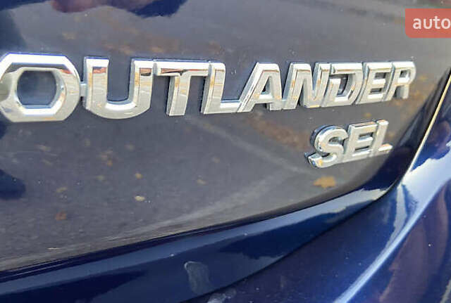 Синий Мицубиси Аутлендер, объемом двигателя 2.36 л и пробегом 71 тыс. км за 13800 $, фото 11 на Automoto.ua