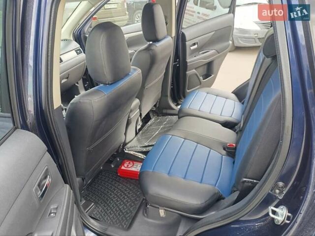 Синий Мицубиси Аутлендер, объемом двигателя 2.4 л и пробегом 134 тыс. км за 15200 $, фото 7 на Automoto.ua