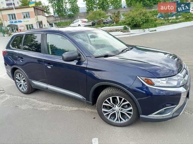 Синий Мицубиси Аутлендер, объемом двигателя 2.4 л и пробегом 134 тыс. км за 15200 $, фото 1 на Automoto.ua