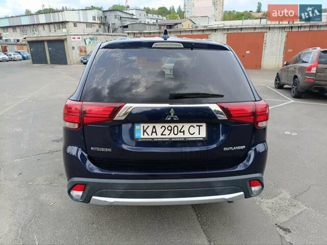 Синий Мицубиси Аутлендер, объемом двигателя 2.4 л и пробегом 134 тыс. км за 15200 $, фото 3 на Automoto.ua
