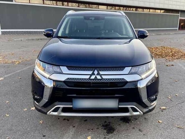 Синий Мицубиси Аутлендер, объемом двигателя 2.4 л и пробегом 71 тыс. км за 11800 $, фото 1 на Automoto.ua