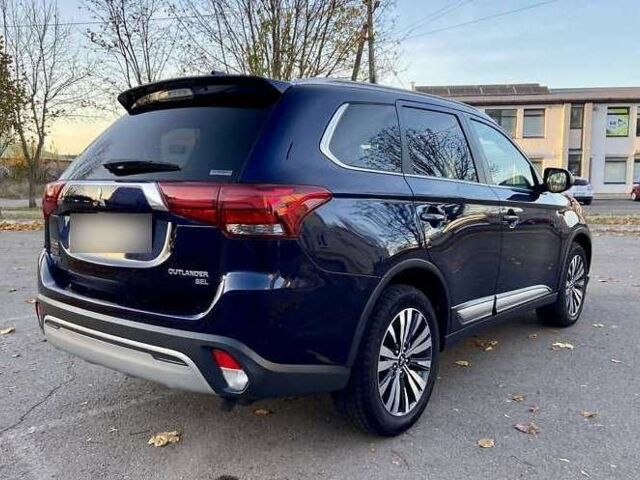 Синий Мицубиси Аутлендер, объемом двигателя 2.4 л и пробегом 71 тыс. км за 11800 $, фото 6 на Automoto.ua