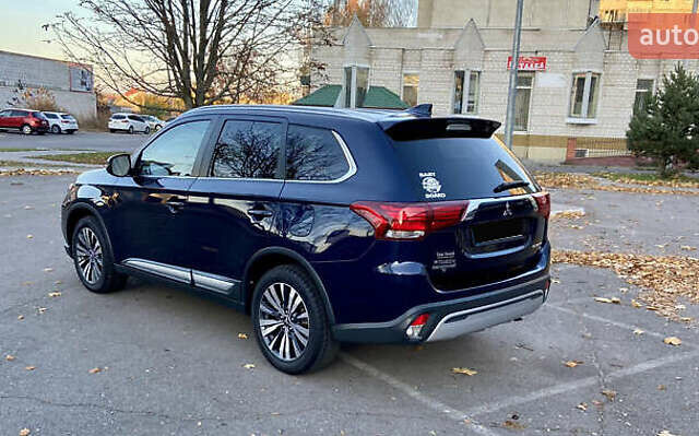 Синий Мицубиси Аутлендер, объемом двигателя 2.36 л и пробегом 71 тыс. км за 13800 $, фото 5 на Automoto.ua