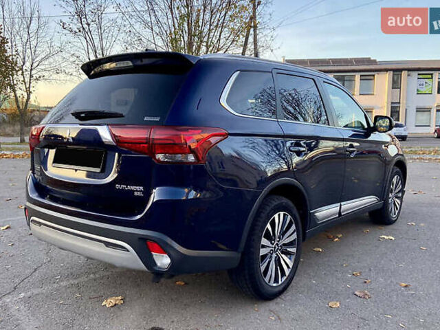 Синий Мицубиси Аутлендер, объемом двигателя 2.36 л и пробегом 71 тыс. км за 13800 $, фото 7 на Automoto.ua