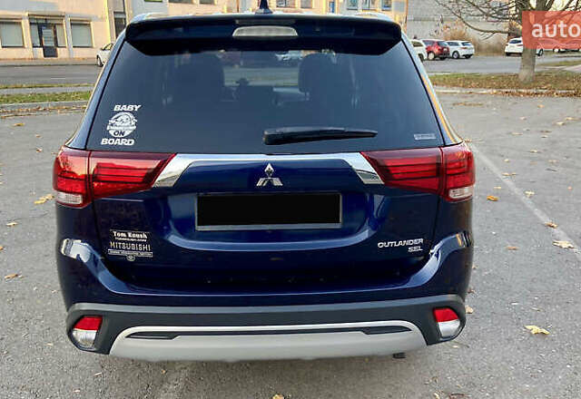 Синий Мицубиси Аутлендер, объемом двигателя 2.36 л и пробегом 71 тыс. км за 13800 $, фото 6 на Automoto.ua