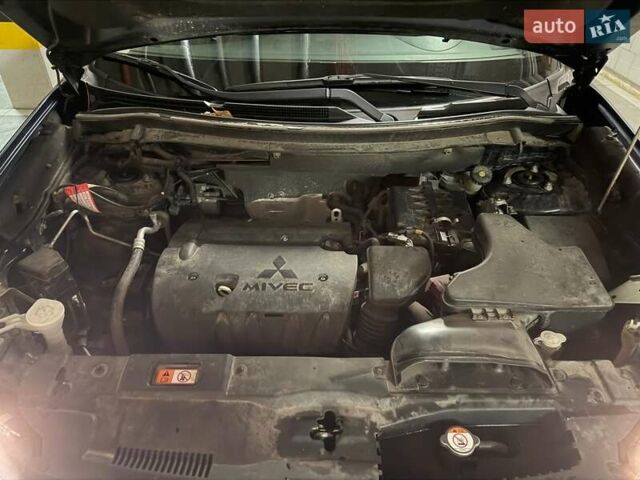 Синій Міцубісі Аутлендер, об'ємом двигуна 2 л та пробігом 128 тис. км за 20000 $, фото 11 на Automoto.ua