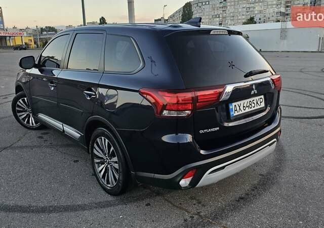 Синий Мицубиси Аутлендер, объемом двигателя 2.4 л и пробегом 106 тыс. км за 16500 $, фото 6 на Automoto.ua