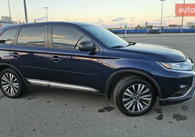 Синий Мицубиси Аутлендер, объемом двигателя 2.4 л и пробегом 106 тыс. км за 16500 $, фото 7 на Automoto.ua