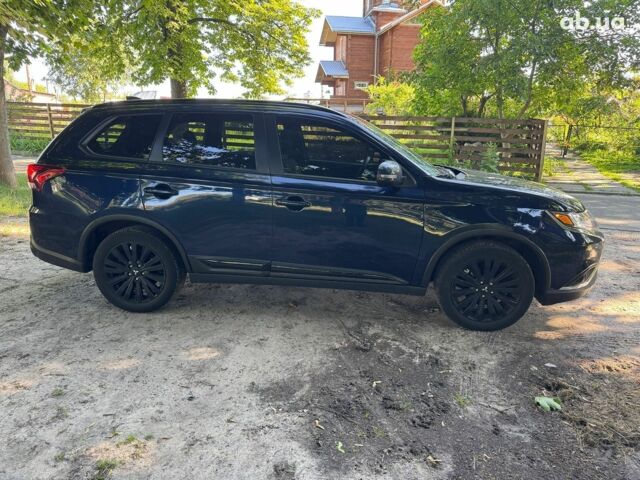 Синий Мицубиси Аутлендер, объемом двигателя 2.4 л и пробегом 75 тыс. км за 15990 $, фото 3 на Automoto.ua
