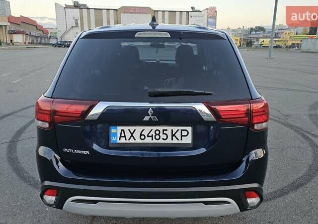 Синий Мицубиси Аутлендер, объемом двигателя 2.4 л и пробегом 106 тыс. км за 16500 $, фото 1 на Automoto.ua