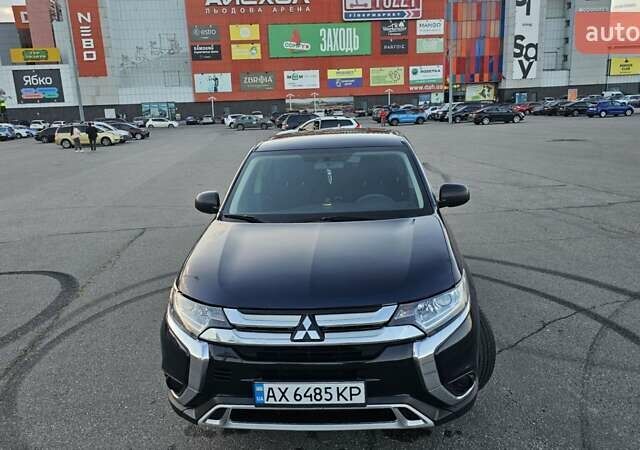 Синий Мицубиси Аутлендер, объемом двигателя 2.4 л и пробегом 106 тыс. км за 16500 $, фото 2 на Automoto.ua
