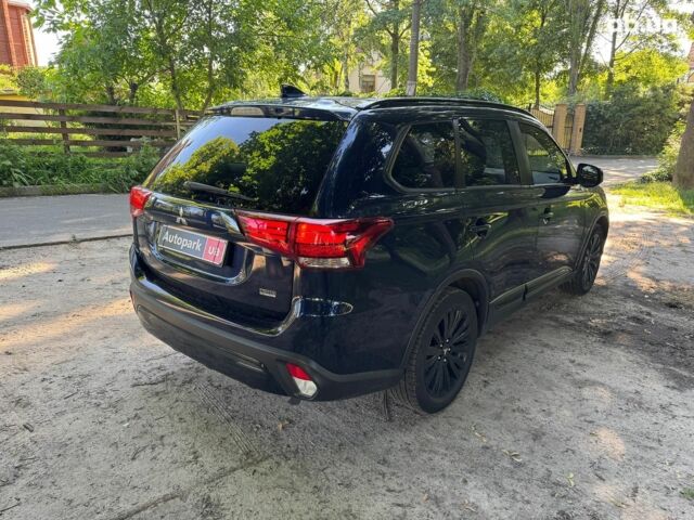 Синий Мицубиси Аутлендер, объемом двигателя 2.4 л и пробегом 75 тыс. км за 15990 $, фото 4 на Automoto.ua