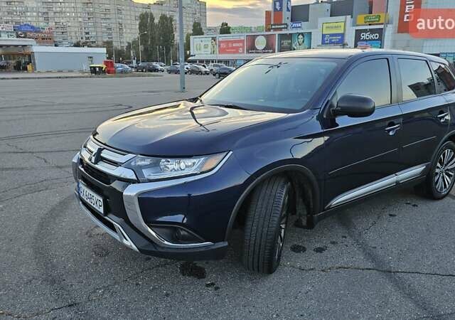 Синий Мицубиси Аутлендер, объемом двигателя 2.4 л и пробегом 106 тыс. км за 16500 $, фото 5 на Automoto.ua