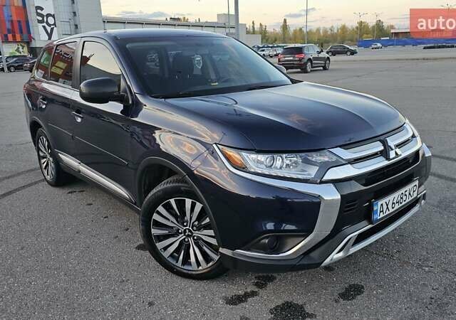 Синий Мицубиси Аутлендер, объемом двигателя 2.4 л и пробегом 106 тыс. км за 16500 $, фото 3 на Automoto.ua