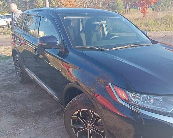 Синий Мицубиси Аутлендер, объемом двигателя 2 л и пробегом 21 тыс. км за 23600 $, фото 2 на Automoto.ua