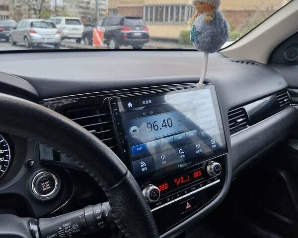 Синий Мицубиси Аутлендер, объемом двигателя 2 л и пробегом 73 тыс. км за 28500 $, фото 12 на Automoto.ua