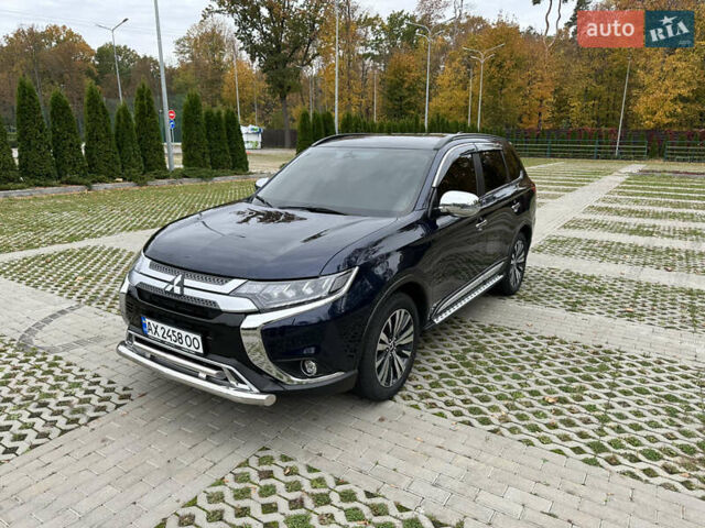 Синий Мицубиси Аутлендер, объемом двигателя 2.36 л и пробегом 47 тыс. км за 19500 $, фото 3 на Automoto.ua
