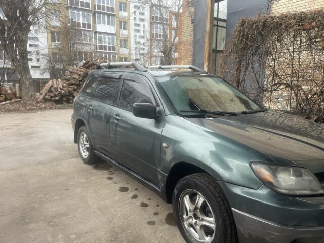 Зелений Міцубісі Аутлендер, об'ємом двигуна 2.4 л та пробігом 3 тис. км за 5000 $, фото 4 на Automoto.ua