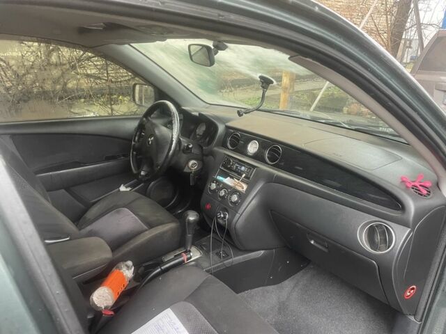 Зелений Міцубісі Аутлендер, об'ємом двигуна 2.4 л та пробігом 3 тис. км за 5000 $, фото 3 на Automoto.ua