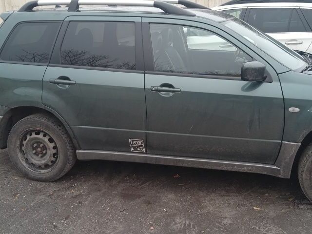 Зеленый Мицубиси Аутлендер, объемом двигателя 2 л и пробегом 220 тыс. км за 6000 $, фото 4 на Automoto.ua