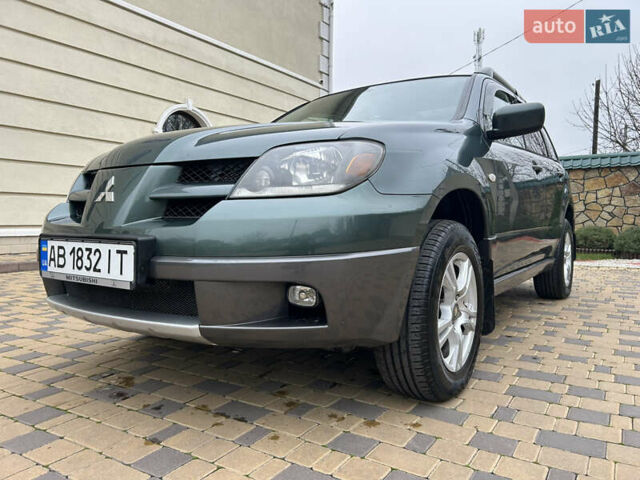 Зеленый Мицубиси Аутлендер, объемом двигателя 2.38 л и пробегом 250 тыс. км за 7200 $, фото 1 на Automoto.ua