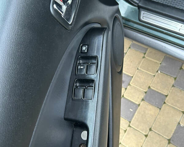 Зеленый Мицубиси Аутлендер, объемом двигателя 2.38 л и пробегом 250 тыс. км за 7200 $, фото 8 на Automoto.ua