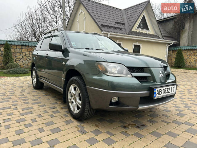 Зеленый Мицубиси Аутлендер, объемом двигателя 2.38 л и пробегом 250 тыс. км за 7200 $, фото 24 на Automoto.ua