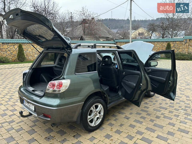 Зеленый Мицубиси Аутлендер, объемом двигателя 2.38 л и пробегом 250 тыс. км за 7200 $, фото 38 на Automoto.ua