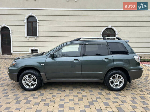 Зеленый Мицубиси Аутлендер, объемом двигателя 2.38 л и пробегом 250 тыс. км за 7200 $, фото 12 на Automoto.ua
