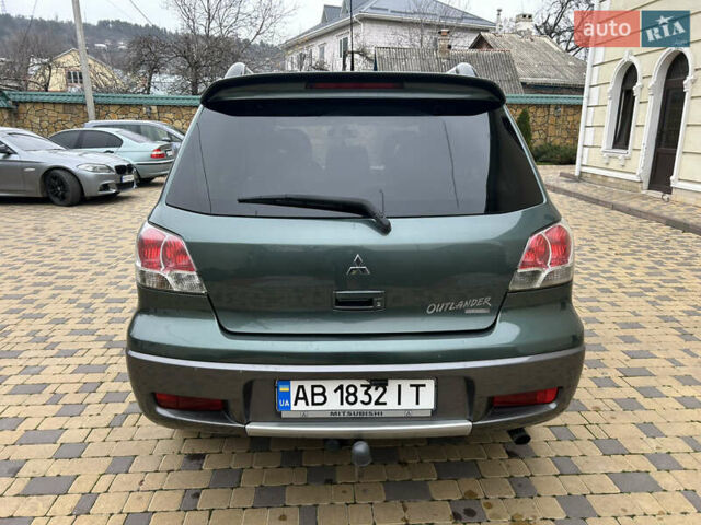 Зеленый Мицубиси Аутлендер, объемом двигателя 2.38 л и пробегом 250 тыс. км за 7200 $, фото 20 на Automoto.ua