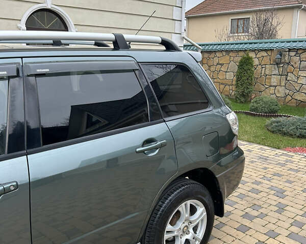 Зеленый Мицубиси Аутлендер, объемом двигателя 2.38 л и пробегом 250 тыс. км за 7200 $, фото 28 на Automoto.ua