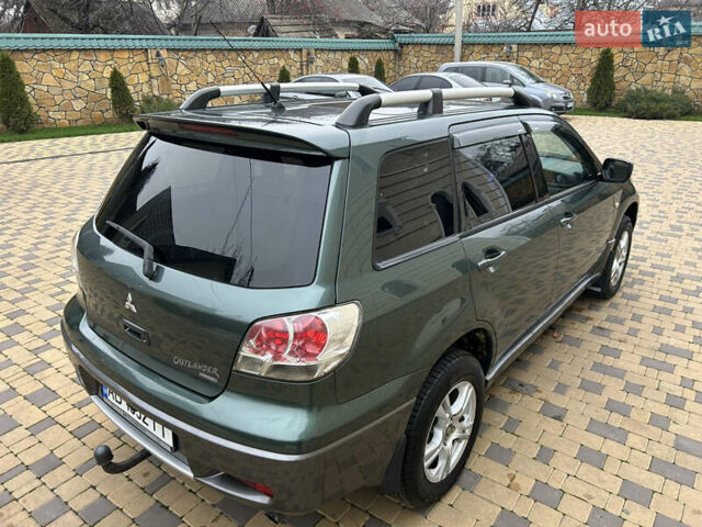 Зеленый Мицубиси Аутлендер, объемом двигателя 2.38 л и пробегом 250 тыс. км за 7200 $, фото 18 на Automoto.ua