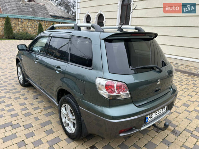 Зеленый Мицубиси Аутлендер, объемом двигателя 2.38 л и пробегом 250 тыс. км за 7200 $, фото 13 на Automoto.ua