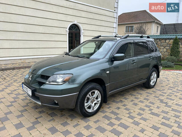 Зеленый Мицубиси Аутлендер, объемом двигателя 2.38 л и пробегом 250 тыс. км за 7200 $, фото 27 на Automoto.ua