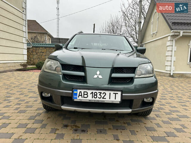 Зеленый Мицубиси Аутлендер, объемом двигателя 2.38 л и пробегом 250 тыс. км за 7200 $, фото 25 на Automoto.ua