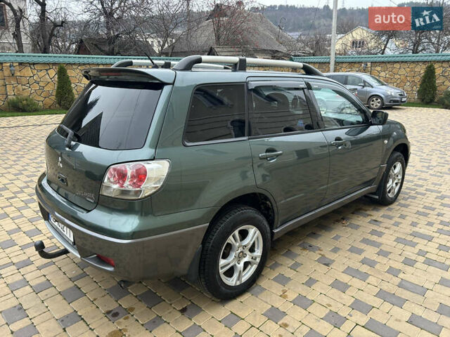 Зеленый Мицубиси Аутлендер, объемом двигателя 2.38 л и пробегом 250 тыс. км за 7200 $, фото 14 на Automoto.ua