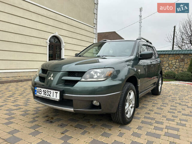 Зеленый Мицубиси Аутлендер, объемом двигателя 2.38 л и пробегом 250 тыс. км за 7200 $, фото 26 на Automoto.ua