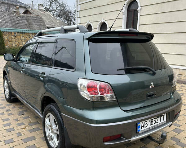 Зеленый Мицубиси Аутлендер, объемом двигателя 2.38 л и пробегом 250 тыс. км за 7200 $, фото 3 на Automoto.ua