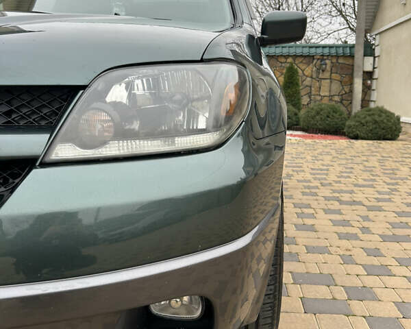 Зеленый Мицубиси Аутлендер, объемом двигателя 2.38 л и пробегом 250 тыс. км за 7200 $, фото 22 на Automoto.ua