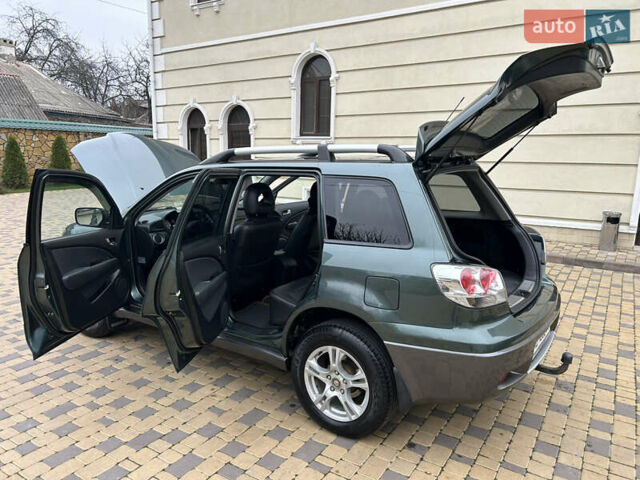 Зеленый Мицубиси Аутлендер, объемом двигателя 2.38 л и пробегом 250 тыс. км за 7200 $, фото 40 на Automoto.ua