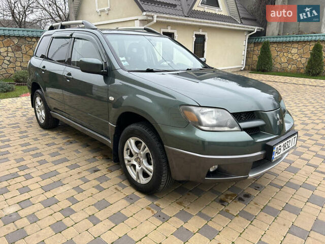 Зеленый Мицубиси Аутлендер, объемом двигателя 2.38 л и пробегом 250 тыс. км за 7200 $, фото 4 на Automoto.ua