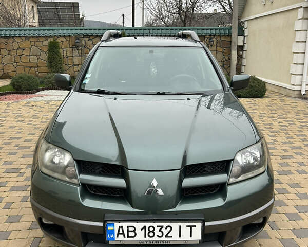 Зеленый Мицубиси Аутлендер, объемом двигателя 2.38 л и пробегом 250 тыс. км за 7200 $, фото 41 на Automoto.ua