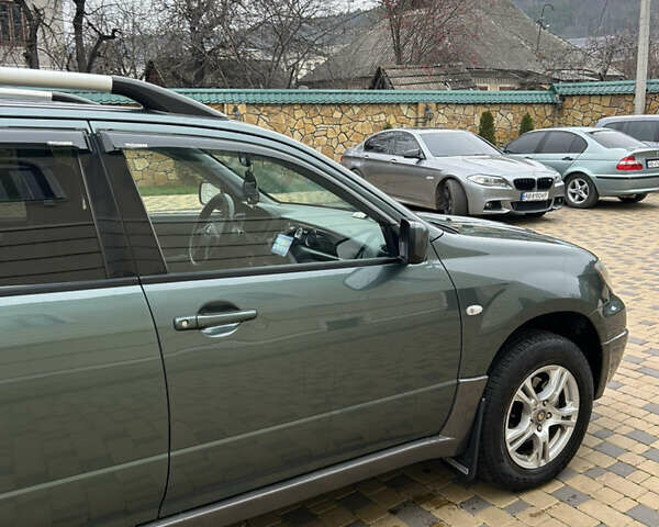 Зеленый Мицубиси Аутлендер, объемом двигателя 2.38 л и пробегом 250 тыс. км за 7200 $, фото 43 на Automoto.ua