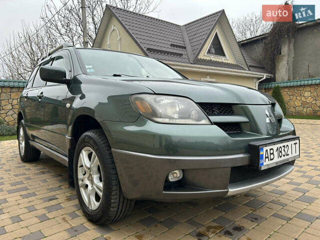 Зеленый Мицубиси Аутлендер, объемом двигателя 2.38 л и пробегом 250 тыс. км за 7200 $, фото 2 на Automoto.ua