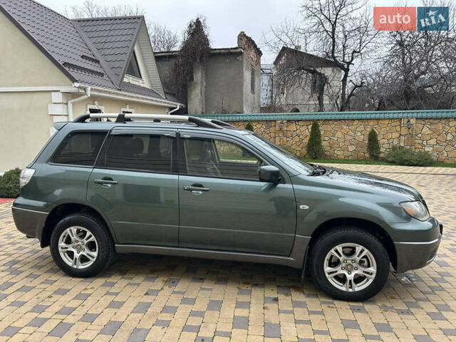 Зеленый Мицубиси Аутлендер, объемом двигателя 2.38 л и пробегом 250 тыс. км за 7200 $, фото 11 на Automoto.ua