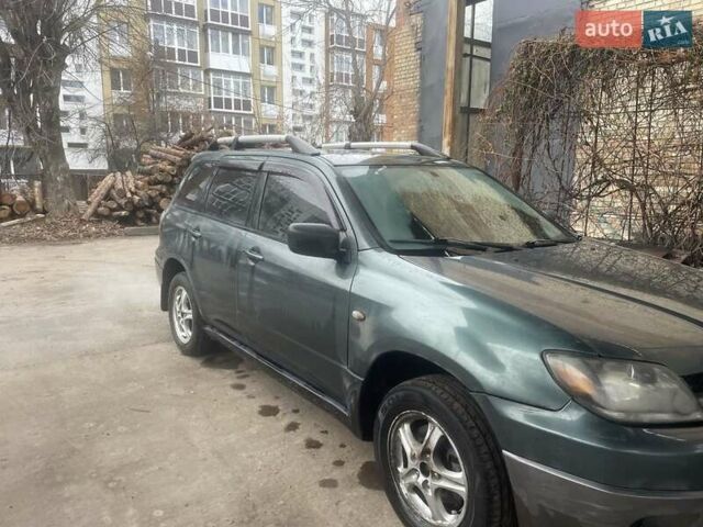 Зелений Міцубісі Аутлендер, об'ємом двигуна 2.4 л та пробігом 300 тис. км за 5000 $, фото 3 на Automoto.ua