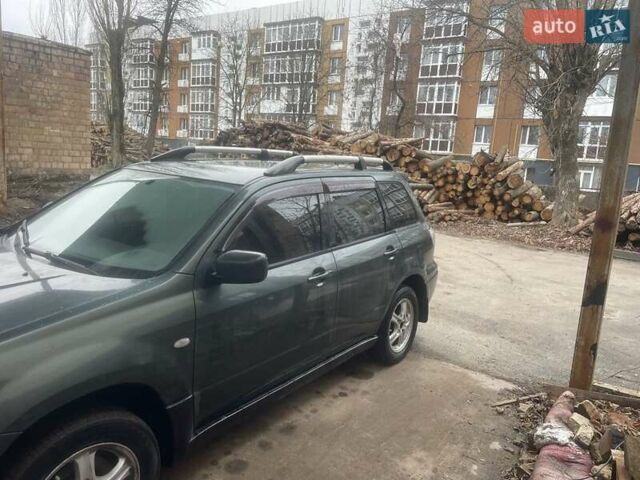Зелений Міцубісі Аутлендер, об'ємом двигуна 2.4 л та пробігом 300 тис. км за 5000 $, фото 5 на Automoto.ua